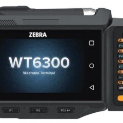 Zebra WT6300 Wearable Android Computer, designed for hands-free use in high-demand industrial and warehouse operations. This rugged device features a touchscreen interface, optional keypad for manual input, and advanced Android OS functionality. It is lightweight and ergonomically designed to be worn on the arm or waist, enabling workers to efficiently manage tasks like order picking, inventory tracking, and real-time data entry while keeping their hands free for other tasks.