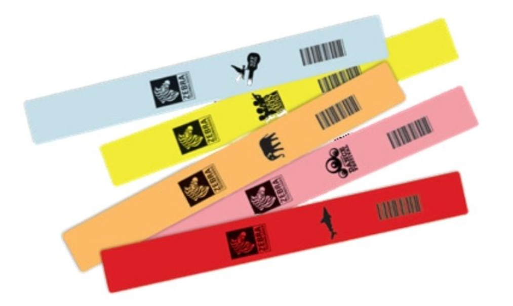Assortment of Zebra Z-Band Splash wristbands in vibrant colours including blue, yellow, orange, pink, and red, featuring barcodes and themed icons for waterproof and durable identification in events or healthcare.