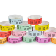 Pyramid arrangement of Zebra Z-Band Splash wristbands in vibrant colours, compatible with HC100 and ZD510-HC printers, designed for durable and waterproof patient or customer identification.