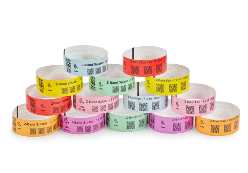 Pyramid arrangement of Zebra Z-Band Splash wristbands in vibrant colours, compatible with HC100 and ZD510-HC printers, designed for durable and waterproof patient or customer identification.