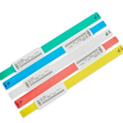 Zebra Z-Band UltraSoft pink baby wristbands cartridge, including wristbands in assorted colours with printed patient information and barcodes, designed for comfortable and secure use in healthcare settings.