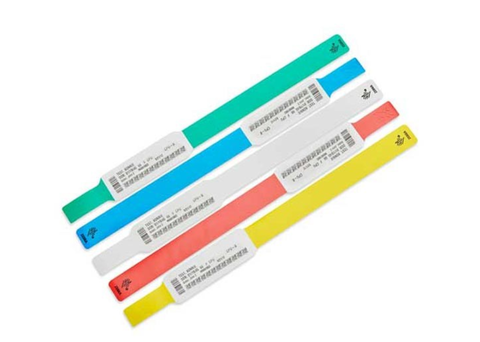 Zebra Z-Band UltraSoft pink baby wristbands cartridge, including wristbands in assorted colours with printed patient information and barcodes, designed for comfortable and secure use in healthcare settings.